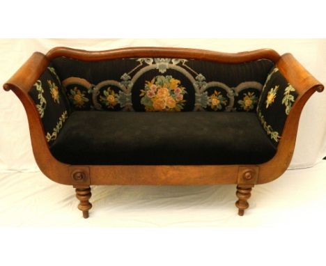 REGENCY STYLE MAHOGANY SOFA 
with a shaped back and scroll arms, covered in floral needle point above a stuffover seat, stand