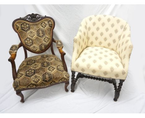 EDWARDIAN MAHOGANY OPEN ARMCHAIR
with a padded shield shape back below a carved shell motif. with outswept arms and a stuffov