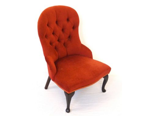 VICTORIAN STYLE NURSING CHAIR
with a shaped button back above a stuffover seat, standing on front cabriole supports 