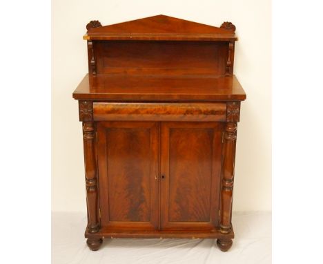MID VICTORIAN MAHOGANY CHIFFONIER
the shaped raised back with a shelf with scroll supports above a cushion frieze baize lined