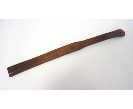 VINTAGE LEATHER TAWSE
marked 'John J. Dick, Maker, Lochgelly', and impressed with the letter 'M' to the handle, the reverse b