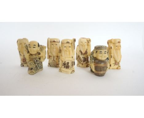 SELECTION OF SEVEN CARVED BONE NETSUKE
depicting a scholar, sage, warrior, wise man holding a tortoise, old man with his staf