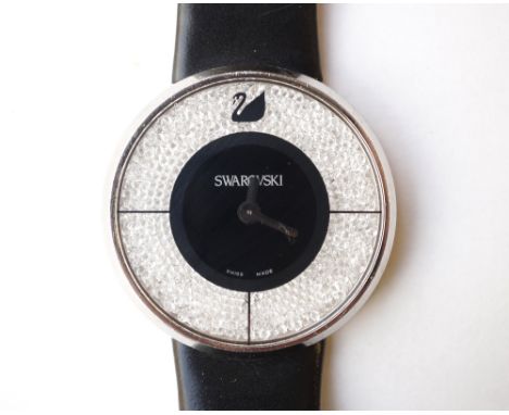 SWAROVSKI CRYSTALLINE WRISTWATCH
the black dial in broad white crystal surround, the backplate numbered 1135988, on black lea