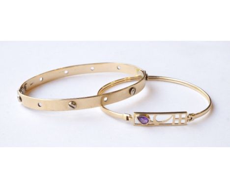 NINE CARAT GOLD MACKINTOSH STYLE BANGLE 
the central pierced section set with amethyst; and a nine carat gold bangle with scr