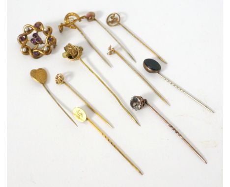 SELECTION OF STICK PINS
including gold and silver examples, four with the Three Legs symbol of the Isle of Man and another wi