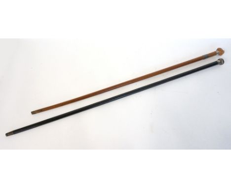 SILVER TOPPED EBONISED WALKING CANE
Birmingham 1922, and a mahogany cane with a boxwood carved hand with entwined serpent fin