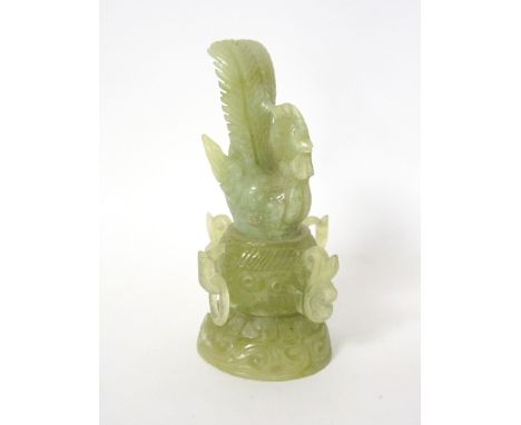 JADE COLOURED HARDSTONE CARVING
depicting a cockeral upon a decorative twin handled bowl on pierced base