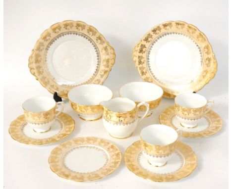 ROSLYN PORCELAIN TEA SERVICE
of white and peach ground with gilt decoration, comprising eleven cups, twelve saucers, twelve s