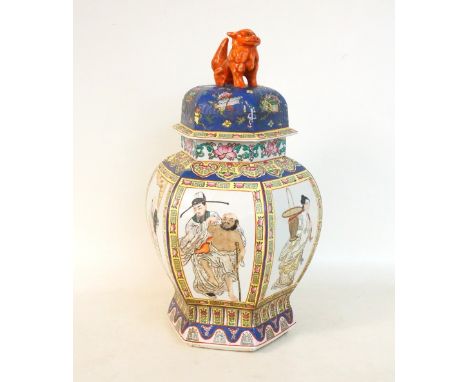 LARGE CHINESE HEXAGONAL PORCELAIN VASE
the cover with lion dog finial, the body decorated with figural panels within a decora