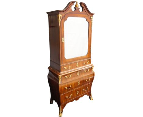 19th CENTURY GERMAN MAHOGANY AND GILT ORMOLU MOUNTED ROCOCO CABINET
the broken arch pediment with a central finial above an a