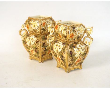 PAIR OF ZSOLNAY PECS PIERCED VASES
circa 1890, with ornate floral decoration and gilt highlights, the handles set on the angl