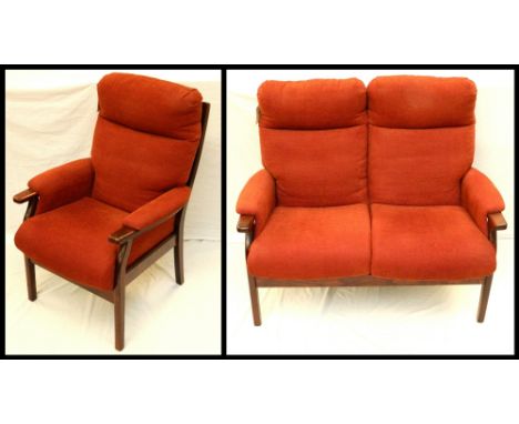 CINTIQUE TWO SEAT SOFA
and matching armchair, with a stained hardwood frame and covered in a terracotta material 