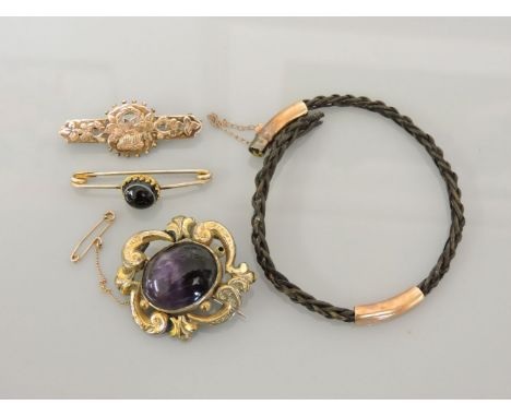 A Victorian cabochon amethyst brooch, a 9ct gold bar brooch, a banded cabochon agate bar brooch, and a plaited elephant hair 