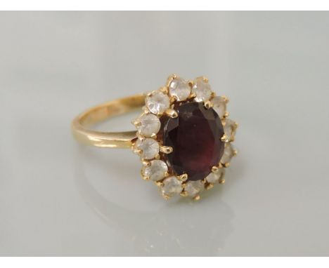 A synthetic ruby and synthetic spinel cluster ring, stamped K18