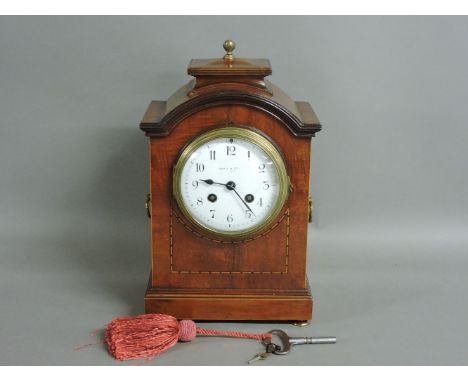 ##An early 20th century mahogany mantel clock, retailed by Maple and Co, with enamel dial, 31cm high