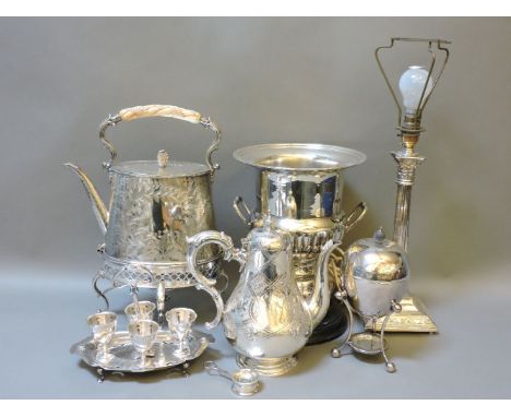 ##Silver plated items, a Victorian kettle on stand, with form decoration, wine cooler, Corinthian column table lamp, egg codd