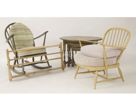 An Ercol plate rack, 96cm wide, an Ercol rocking chair, another Ercol chair, and a nest of tables
