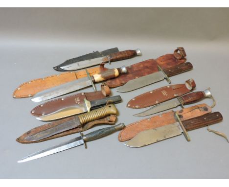 A collection of eight hunting and fishing knives, to include an unmarked WWI Fairbanks-Sykes style fighting knife, the tip ro