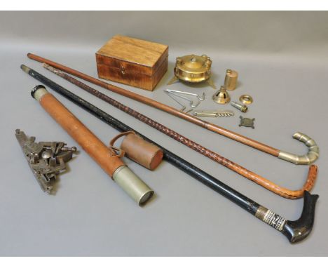 An Indian sword stick, two walking sticks, a leather bound military single drawer telescope, 64.5cm fully extended, a Flintlo