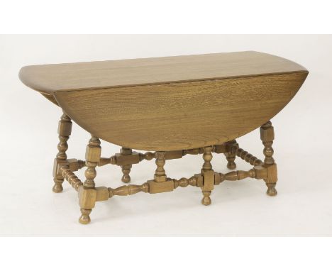 An Ercol elm dropleaf coffee table, 106cm wide