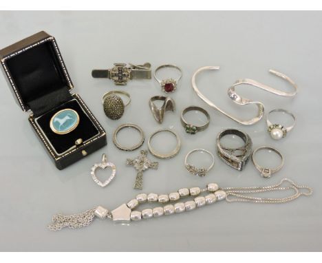 A sardonyx cameo ring, stamped 975, a collection of rings including a red and white paste cluster ring, a white metal twisted