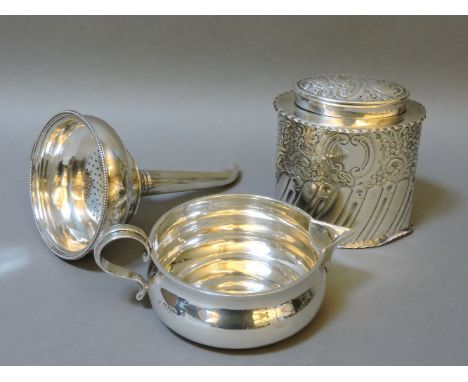 ##Three silver items, a shallow jug, London 1904, an oval embossed tea caddy and lid, Sheffield 1906, 9cm, and a George III w