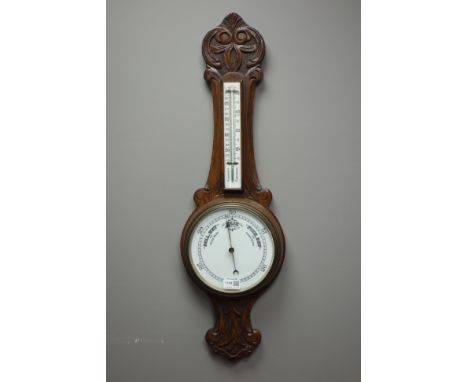 Early 20th century carved oak cased aneroid barometer, H84cm   Condition Report   Click here for further images, condition, a