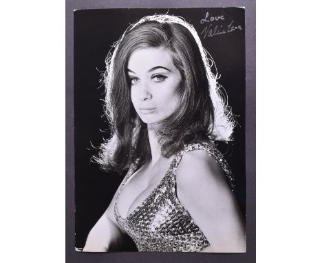 From The Collection Of Valerie Leon - an original vintage large format studio glamour photograph of Leon in a sequinned outfi