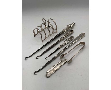 A George V hallmarked silver simple toast rack, (af), Birmingham 1920, a silver bladed and silver bodied pocket knife, a pair