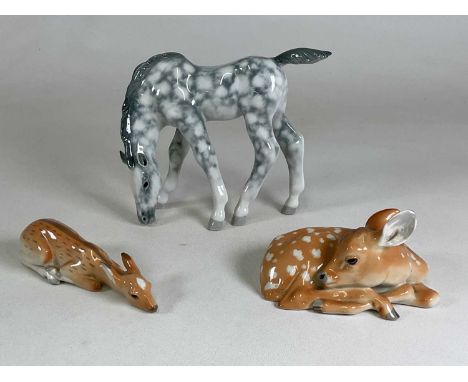 LOMONOSOV OF RUSSIA; ceramic model of a horse grazing, height 19cm, also two deer in recumbent form (3).