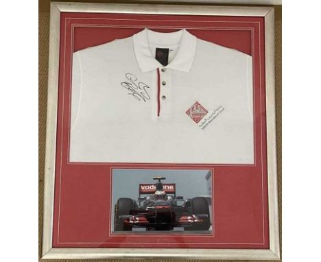 JENSON BUTTON; a shirt from the Bahrain international circuit, signed by the Formula 1 world champion, with colour action sho