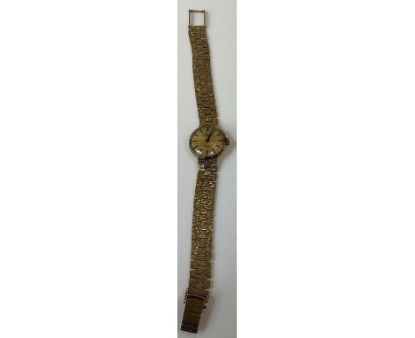 ROTARY; a lady's vintage 9ct yellow gold wristwatch with baton markers to the circular dial and textured bracelet, combined a