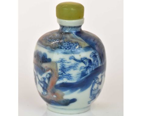 A Chinese porcelain snuff bottle, decorated with monkeys in a continuous landscape, highlighted in faded iron red with painte