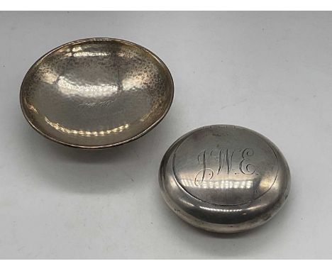 A E JONES; an Arts and Crafts small hammered silver pedestal bowl, with presentation inscription to the centre, Birmingham 19