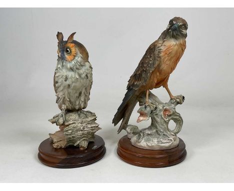 GIUSEPPE ARMANI; model of a bird of prey perched on a tree stump and an owl perched on a hollowed out tree trunk, both mounte