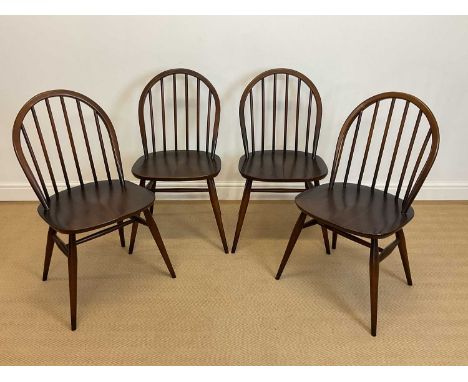 ERCOL; set of four Windsor bow back dining chairs.