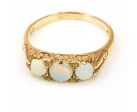 A 9ct yellow gold three stone opal ring with scroll setting, size R, approx 3.44g.