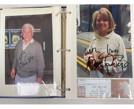 A blue ring folder containing photographs taken by Mike Ormerod which have been signed by the personality, including Lily Sav