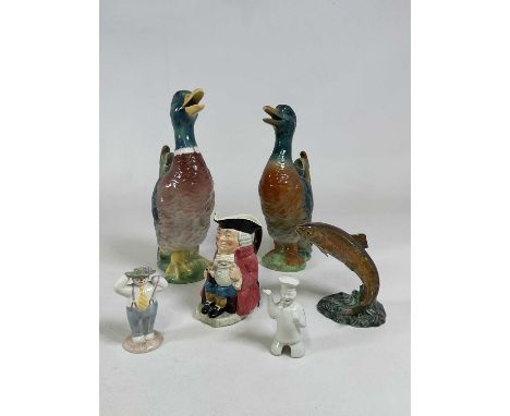 Two French ceramic water jugs in the form of ducks in an upright position, height 40cm, also a Beswick leaping trout, Royal D