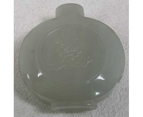 A Chinese carved jade snuff bottle decorated with twin floral sprays to roundels both front and rear, height 5.5cm (lacking s
