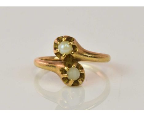 A 14ct yellow gold and simulated twin pearl set crossover ring, size H, approx 2.1g.