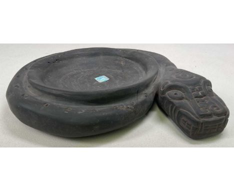 A South American Inca inspired carved stone shallow serpent bowl, width approx 28cm, (af).Provenance: This forms part of a co