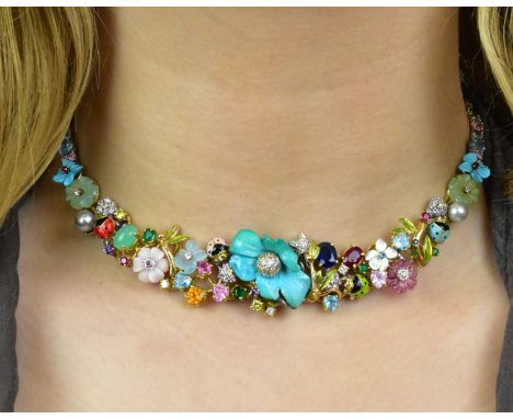SANTAGOSTINO; a wonderful 18ct yellow and white gold multi gem set necklace, with central turquoise flower head centred with 