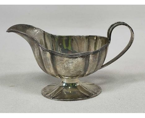 WILLIAM HUTTON &amp; SONS; a George V hallmarked silver sauceboat, with simple loop handle and spreading oval foot, Sheffield