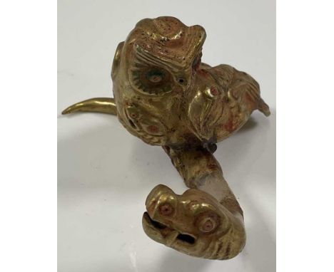 A South American Inca inspired carved crystal and yellow metal mounted owl upon serpent, length 11.5cm.Provenance: This forms