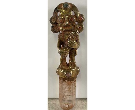 A South American Inca inspired carved crystal sceptre, with figural yellow metal mount and loops to the reverse where it can 