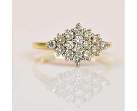 An 18ct yellow gold and diamond lozenge shaped ring, the stepped platform set with sixteen round brilliant cut diamonds, size