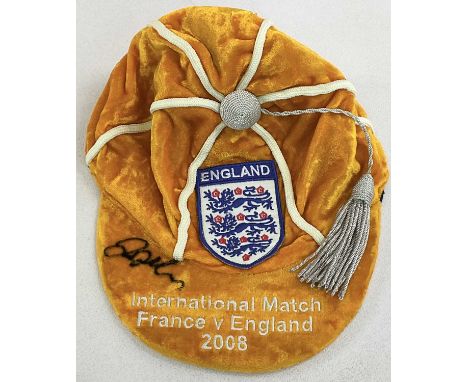 DAVID BECKHAM; an orange velvet England cap for the International Match France vs England 2008, signed by the world famous st