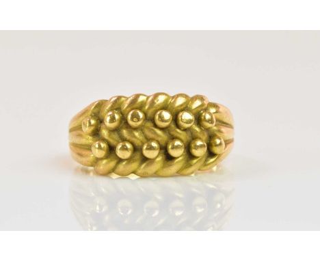 An 18ct yellow gold ring with raised detail, size Q, approx 11.31g.
