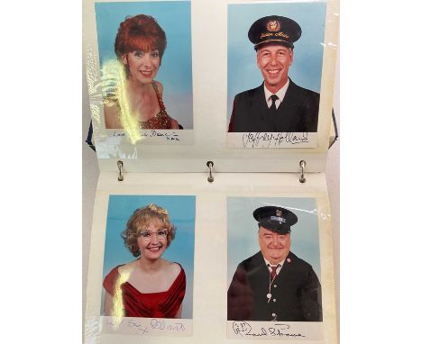 A blue ring binder containing group and individual colour photo cards signed by the cast and signed individually, for shows i